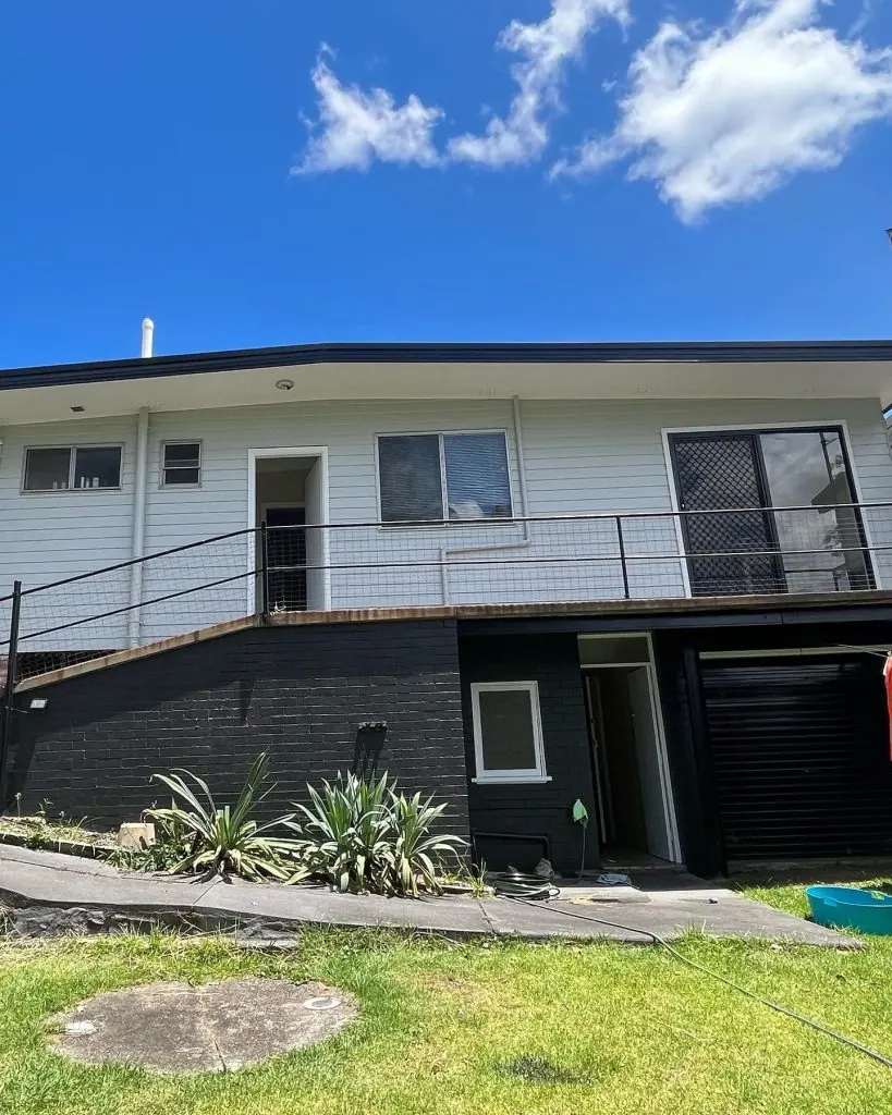 Two-storey Newcastle home repainted in white and charcoal