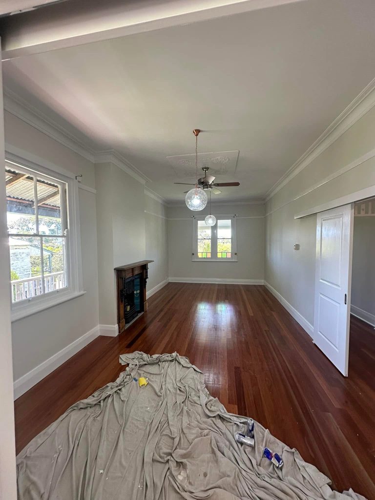 Internal House Painting on a heritage home in Newcastle, shows the old fireplace and surrounding room